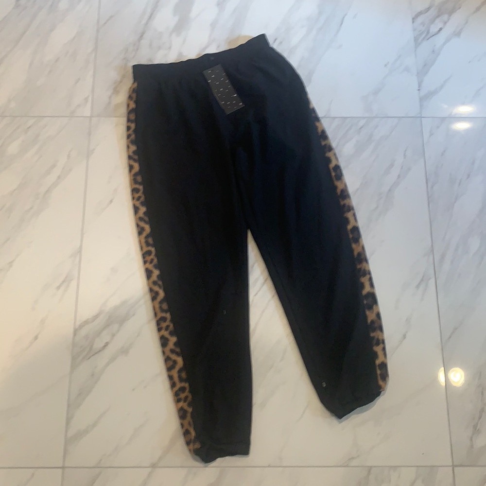 Terez woman’s thin pants size M black with leopard print stripe down the side
